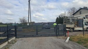 a fence with a man standing behind it